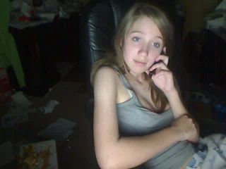 Cute blonde teen playing with titts and pussy on the phone webcam-4