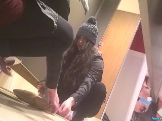 Teen tries pants in dressing  room-7