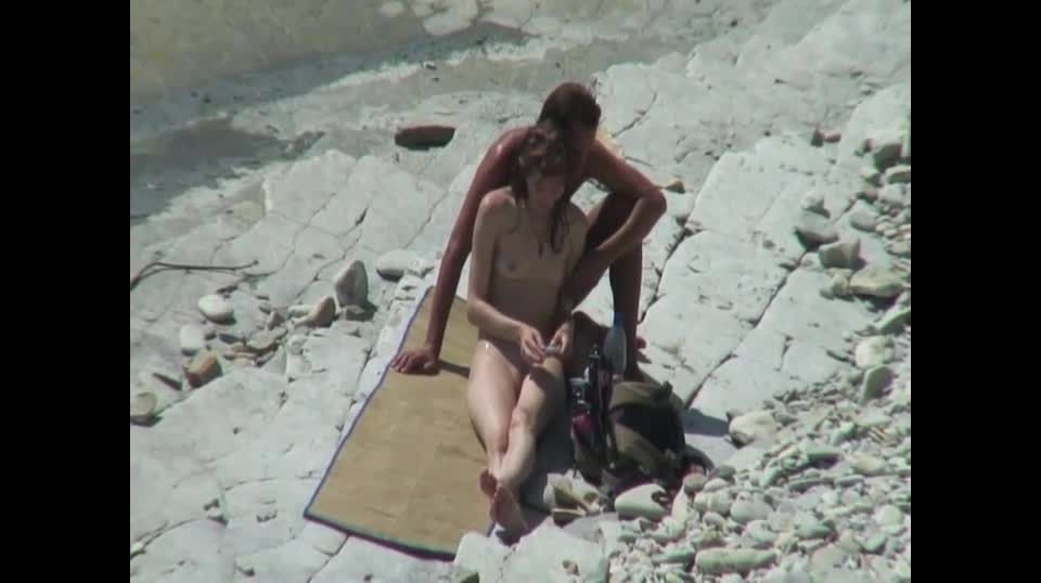 Skinny girl with her man on a beach Nudism!