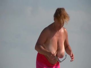 Gigantic mature tits on a beach Nudism-2