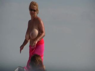 Gigantic mature tits on a beach Nudism-5