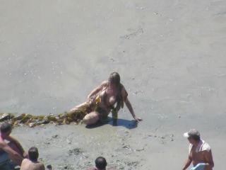 Wacky nudist woman rolls in the  mud-6