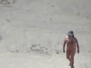 Wacky nudist woman rolls in the  mud-9