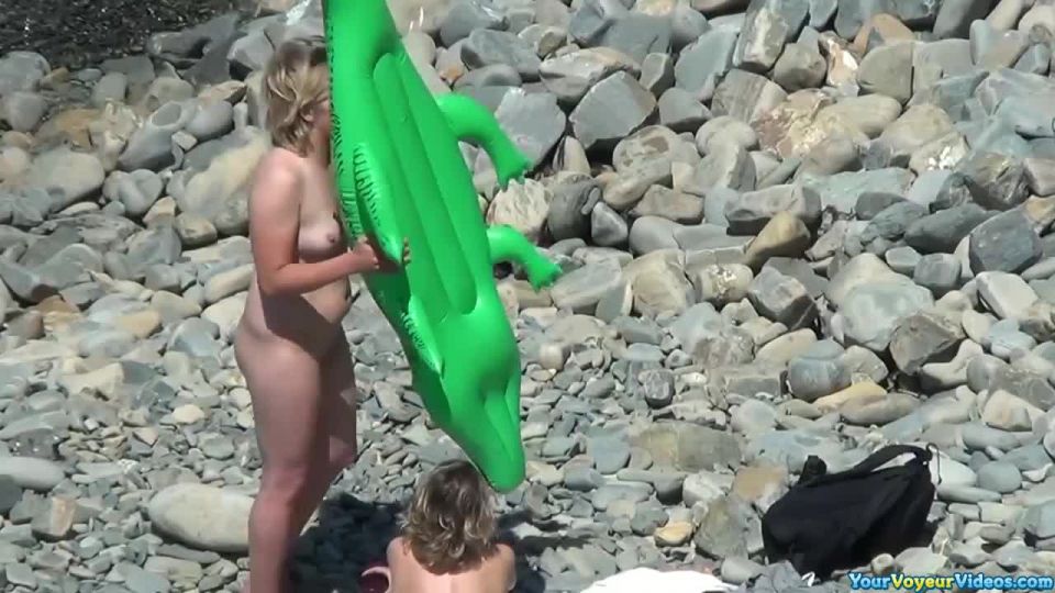 Nudists at the rocky beach