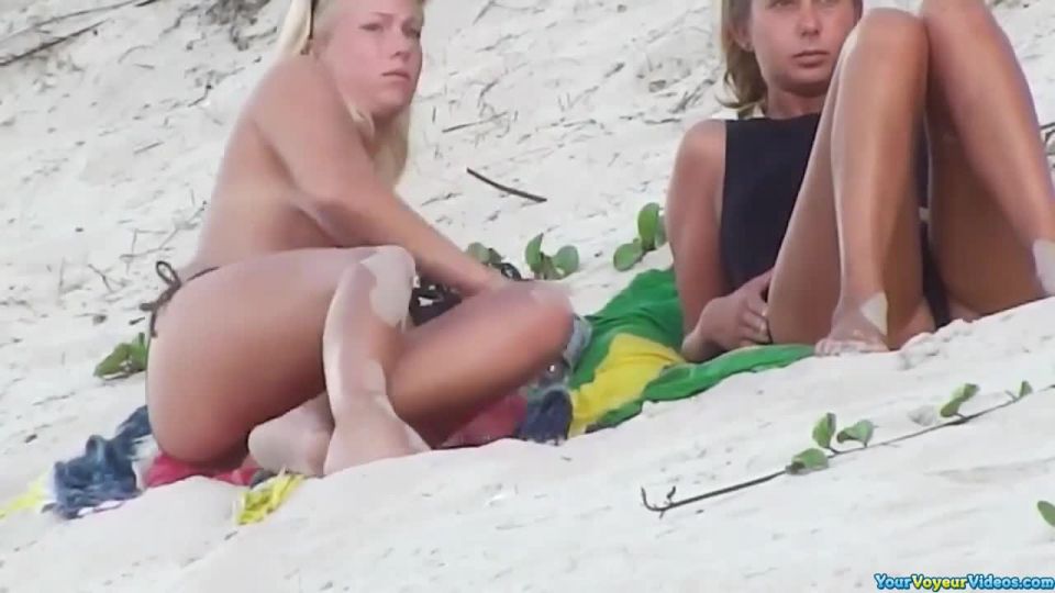 Topless blonde teen at beach