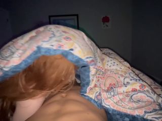 Sexy redhead girlfriend sucking dick under cover while watching TV - Amateur-6