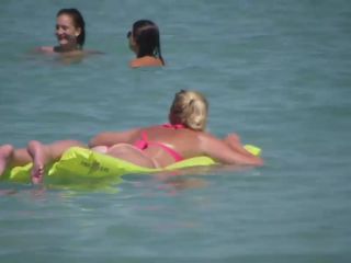 Pale buttocks in a pink thong bikini-1