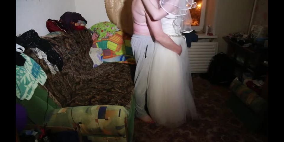 Bride in wedding dress doing blowjob to the camera