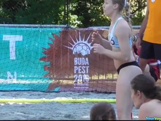 Sporty chicks playing beach handball-5