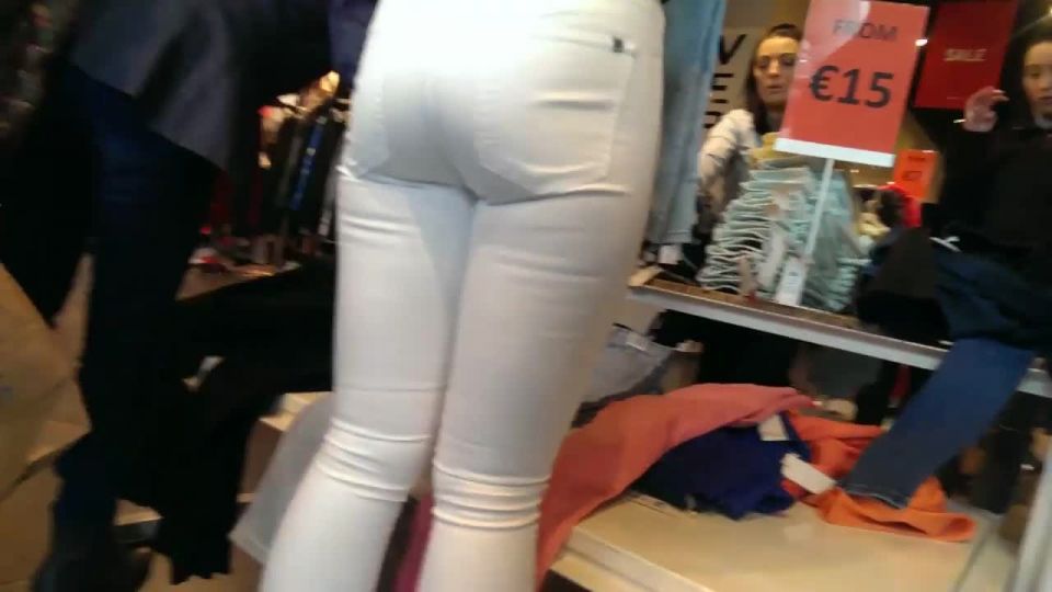 Store worker in tight white pants