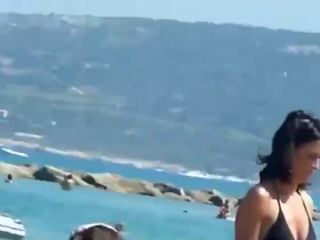 Mature topless woman spied on a beach-6