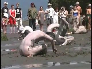 Bunch of nudists exercising on the  beach-1