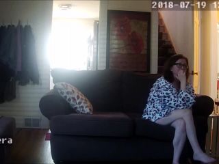 Horny wife watching phone porn and fingering pussy on the couch. hidden cam-2