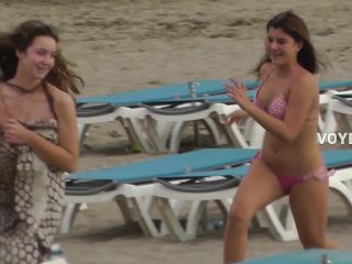 Cute girl chases friends on the beach-6