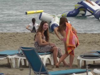 Cute girl chases friends on the beach-9