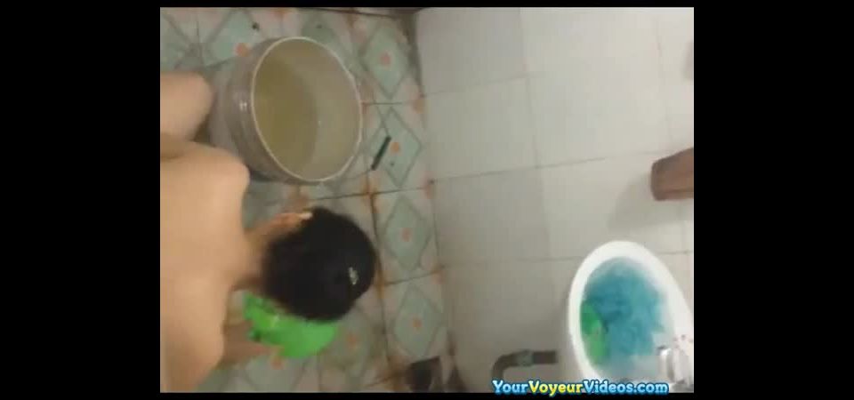 Voyeur films asian woman in bathroom