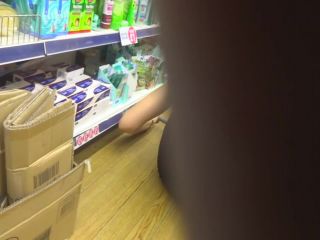 Store clerk bending over in front of  me-1